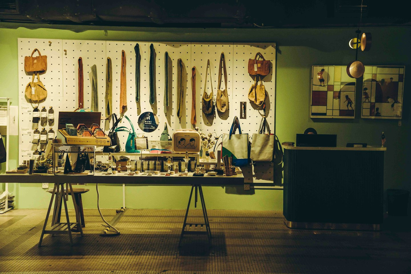 Handmade bags and accessories arranged on a boutique display table.